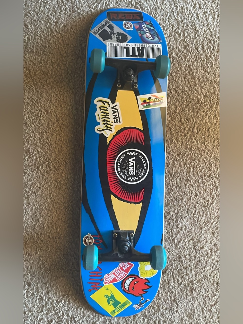 8.25 Toy machine Blue Graphic Skateboard with Teal Wheels